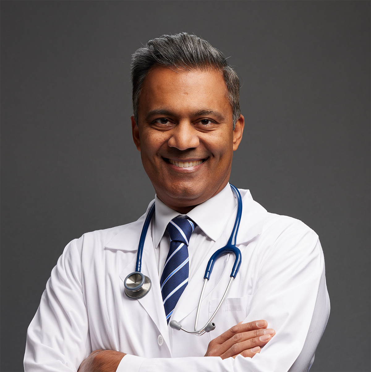 Headshot of Dr. Amish Shah wearing his white doctors coat and stethoscope. 